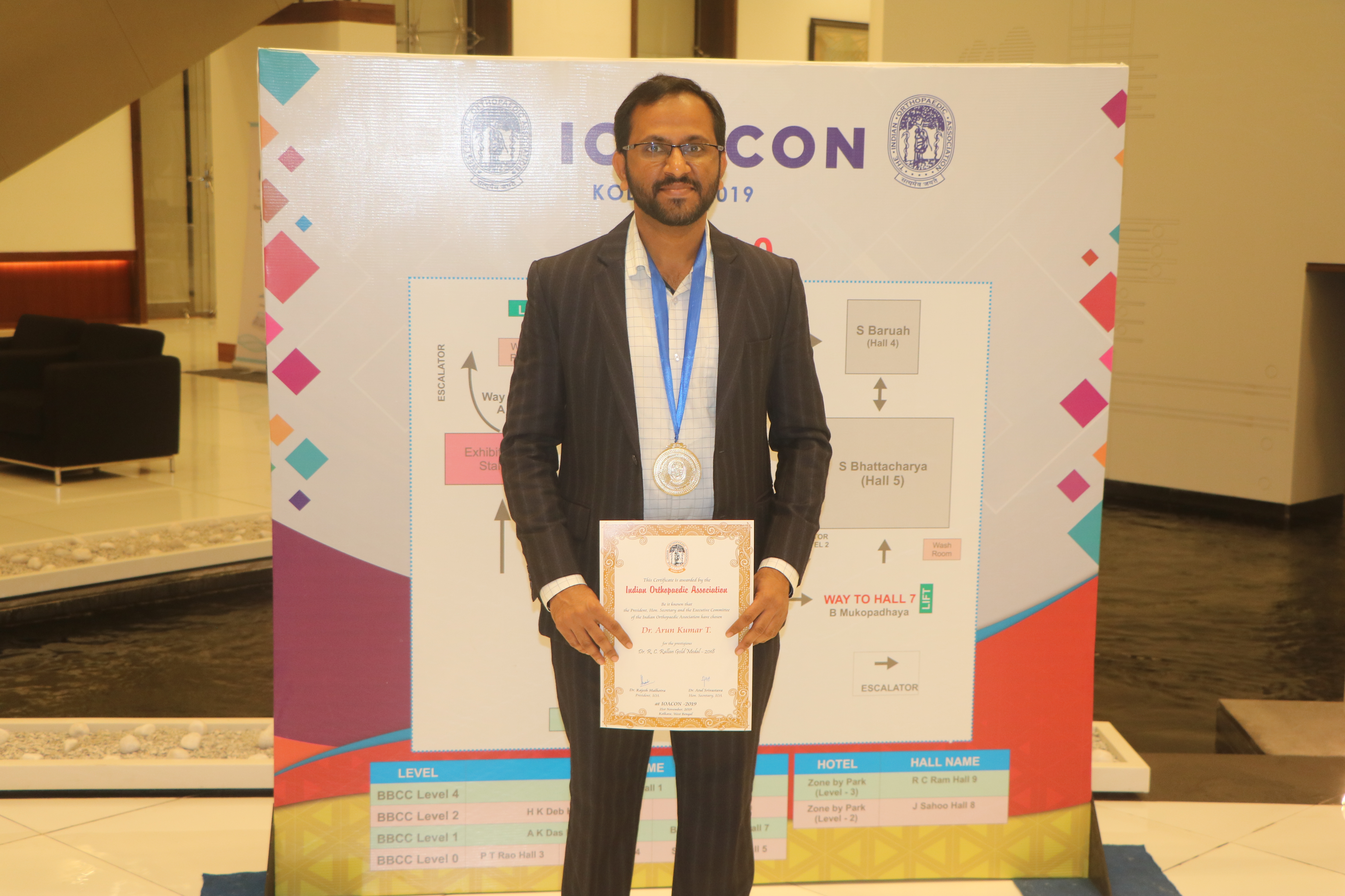 Dr. Arunkumar posing with certificate